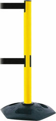 Tensator - 38" High, 2-1/2" Pole Diam, 4 Way Stanchion - 19" Base Diam, Octagon Recycled Rubber Base, Yellow Plastic Post, 7-1/2' x 2" Tape, Dual Line Tape, For Outdoor Use - Makers Industrial Supply