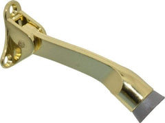 National Mfg. - 4" Projection Kickdown Door Stop - Door Mount, Brass Finish - Makers Industrial Supply